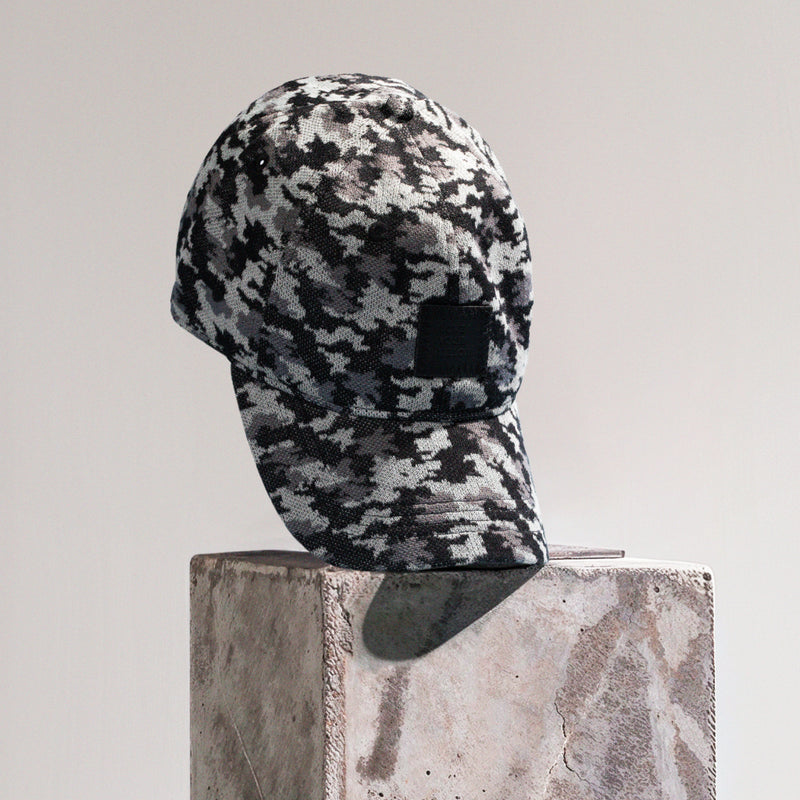 Presentational image of a cap with a camo pattern