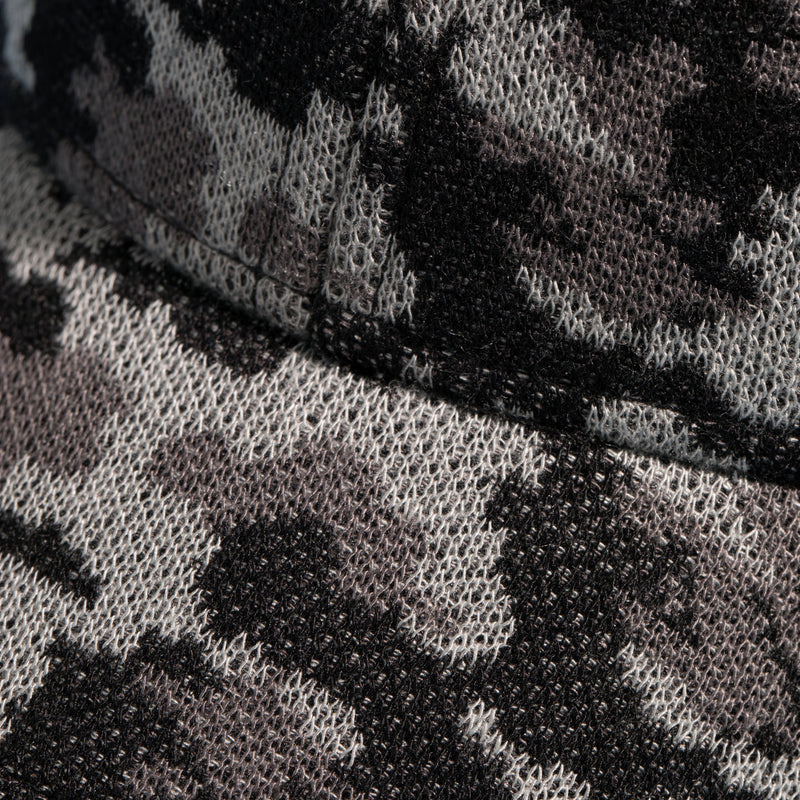 Extreme close-up of a camo-patterned cap