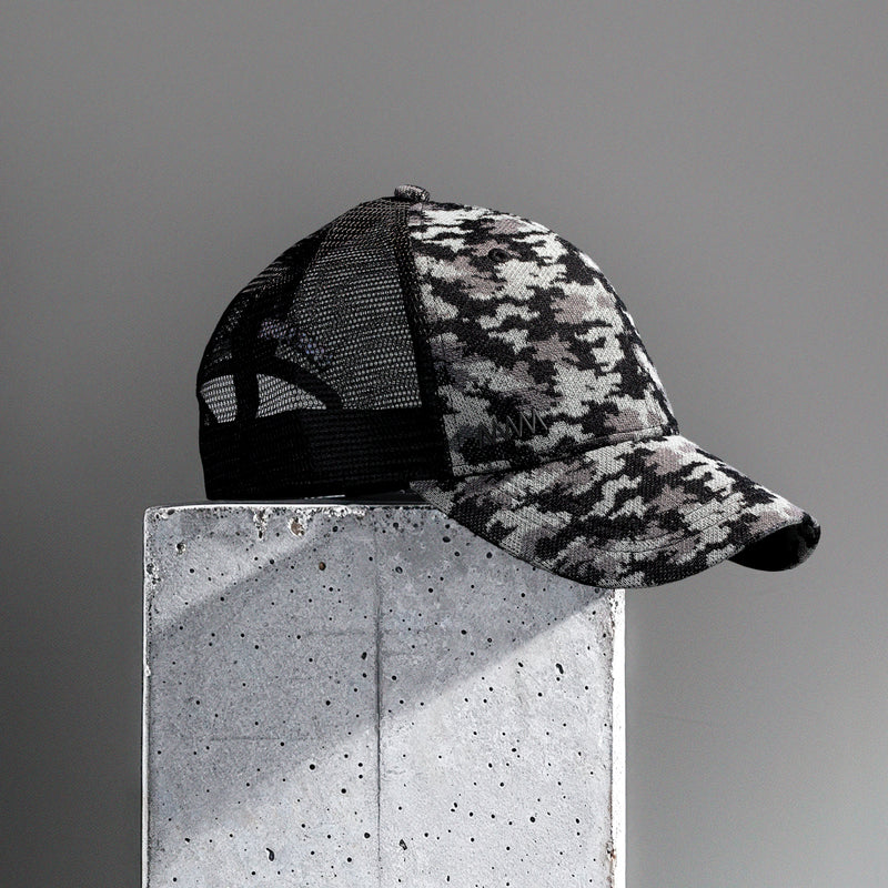 Presentational image of a mesh cap with a camo pattern
