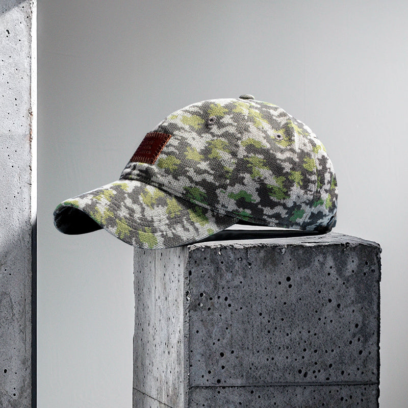 Presentational image of a cap with a camo pattern
