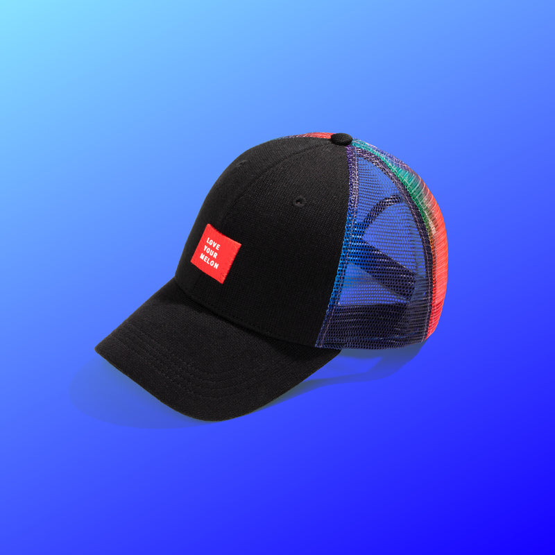 Mesh cap sitting a light blue to dark blue gradient background