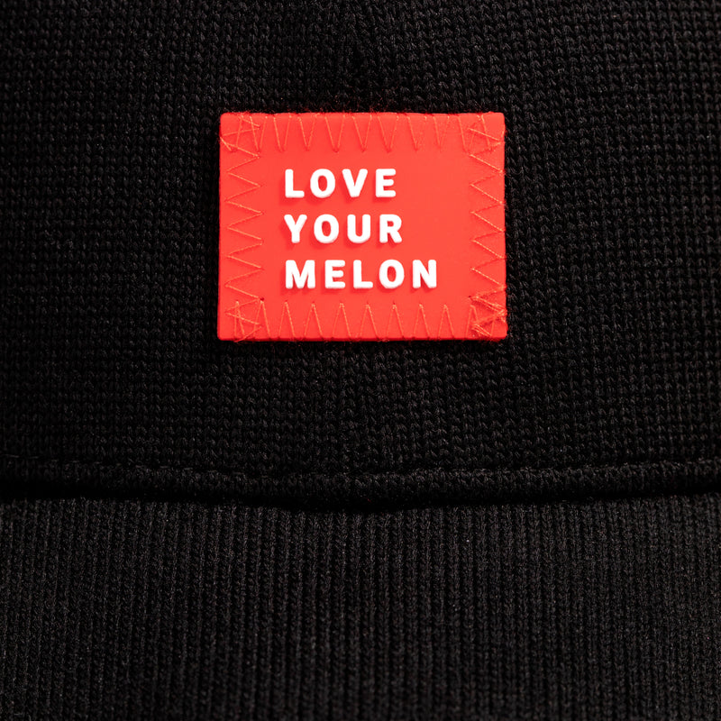 Close of up "Love Your Melon" label on fabric